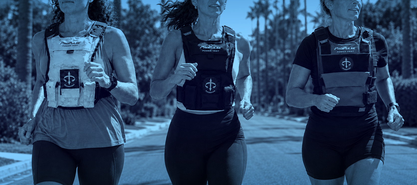 Three women running in the ProPulse Power Vest